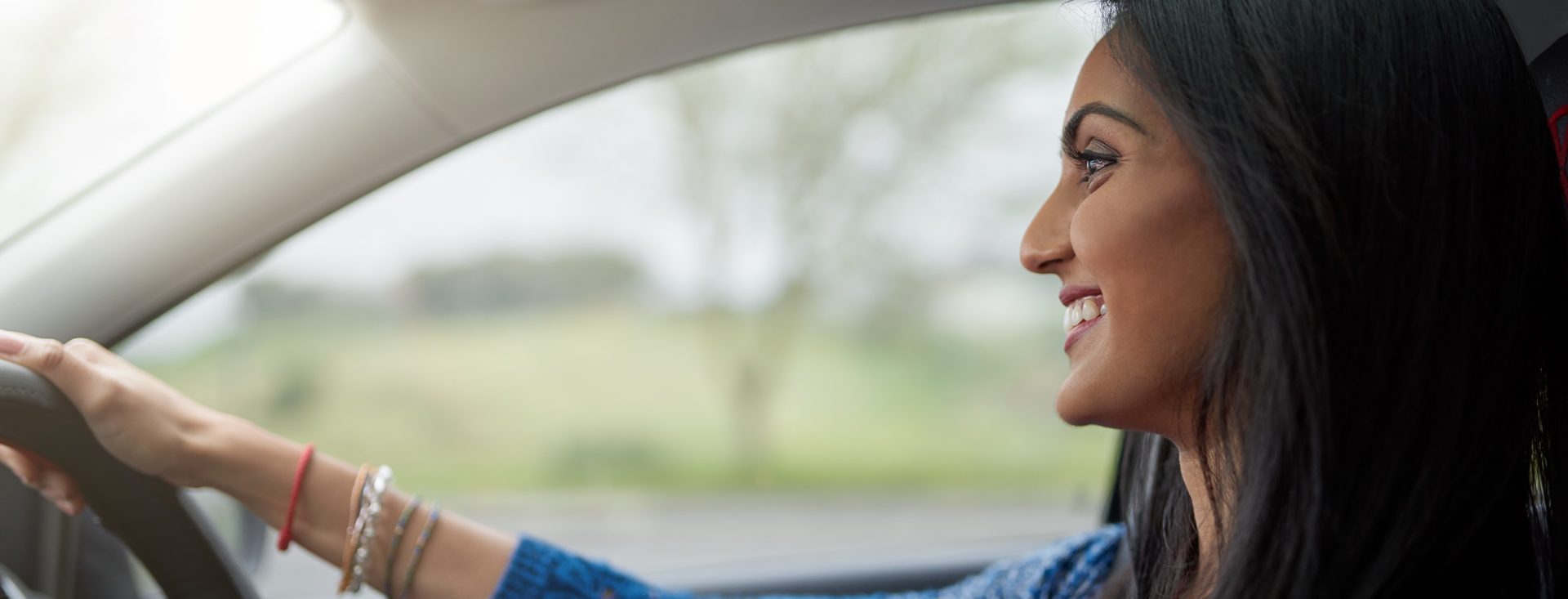 Independence is a great feelling. Shot of an attractive young woman driving her car