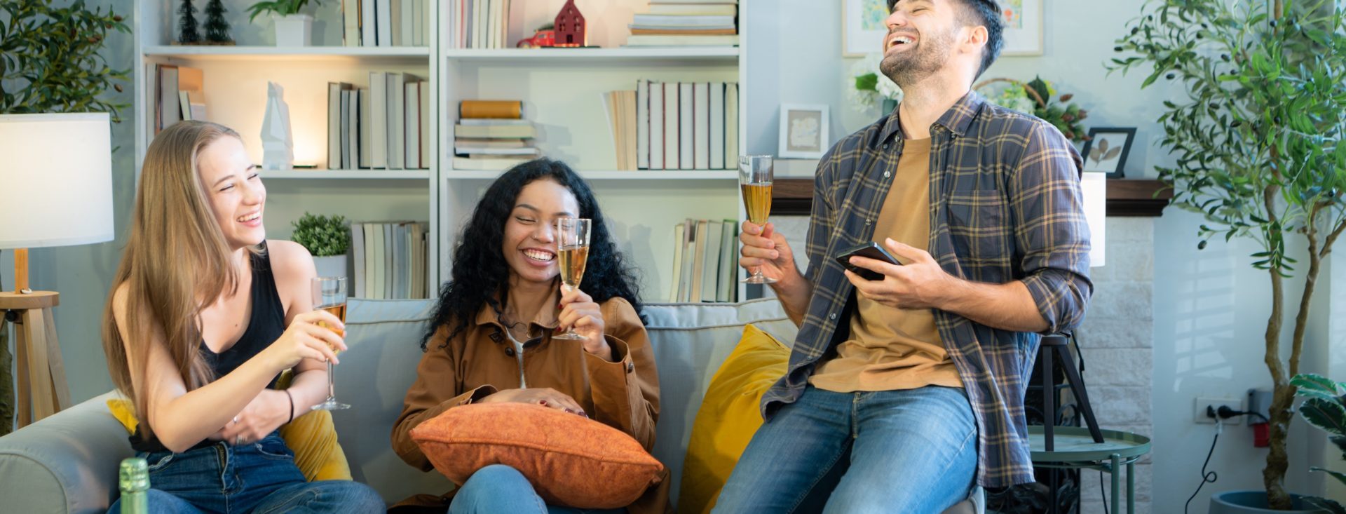 Multiethnic friends had fun party and drinking wine at home.