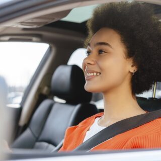 Smiling woman driving car. Cheerful young happy African American female driving car with safety SSUCv3H4sIAAAAAAAACpySz26DMAzG75P2DijnItFktLBXqXYwSYCoaVIlodNU9d2XP4C86274Z/uzv5jn+1tVkQG84uSzeqYoxkrrxQcHQVkTcXNYuZNGSIfJw7FTgwEoHEmhgnUKNIYDBD4buMkIzaJ1wq+cJD5AWLz0aZcVcQhyihoF7hJl4UuJqy2Rk7Ejpgg5IOaXIbMNFfF/dZaPr93wJA3/yQsjI05qCcXIpZSS63eQ7oatwSKURa4eloNOBQwpgbqDgz99d6e4MhMiNsz5LpsSt4sJLm21myHa2jsMOr36GMfIjc/gfSwXG0ezefwL7A3NMTZkT6sqEfE4KTwy1nYtbVrW9rRl/YmtBeWgs4o6eZ1NKMb8qgR2pdIGhB+FpF3b1MczHeoPGLu6ayjU576nJ9rzcaQ03uL1CwAA//8DAPdTwXG5AgAA